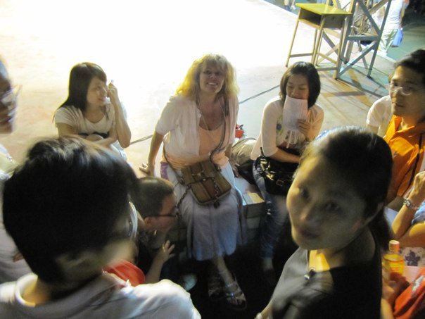 "dutifully posing for photos'