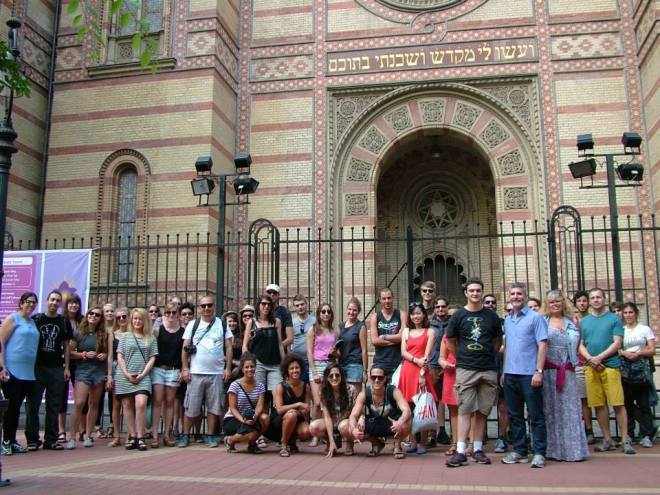 taking a tour, starting outside the synagogue 