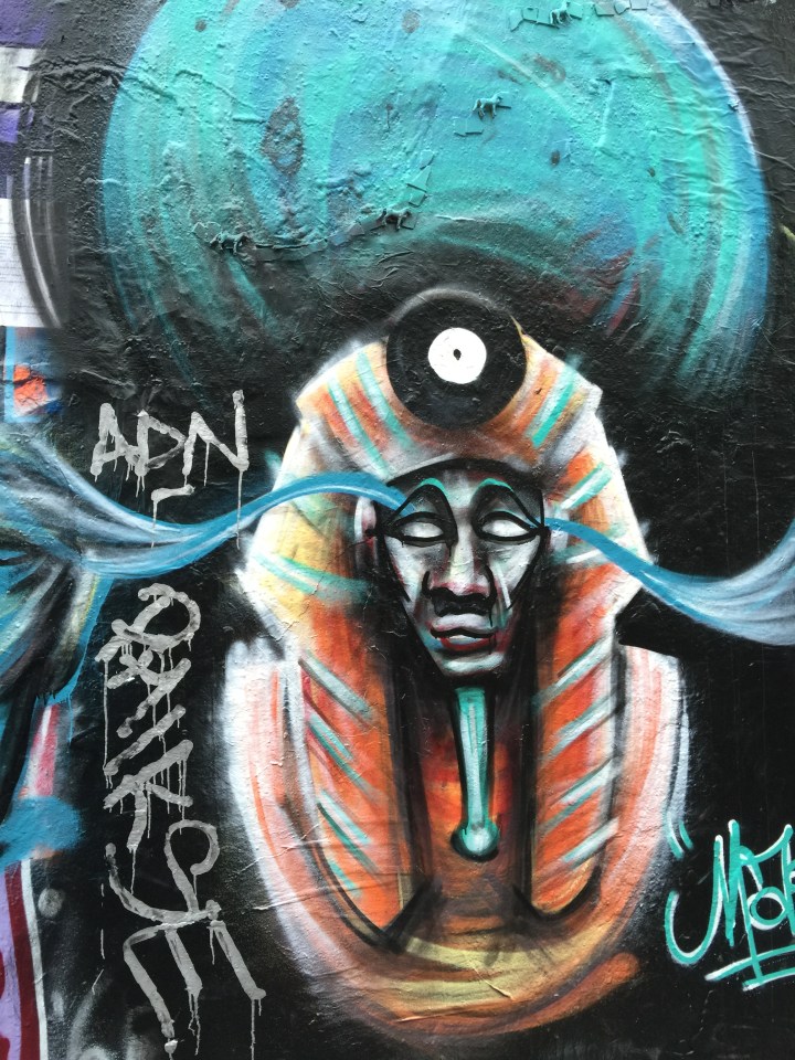 When I went back the next day this was being painted over by a (female) graffiti-ist.  