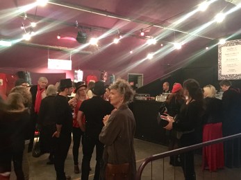 In the bar; most people adhered to the request for red and black outfits for the tea party