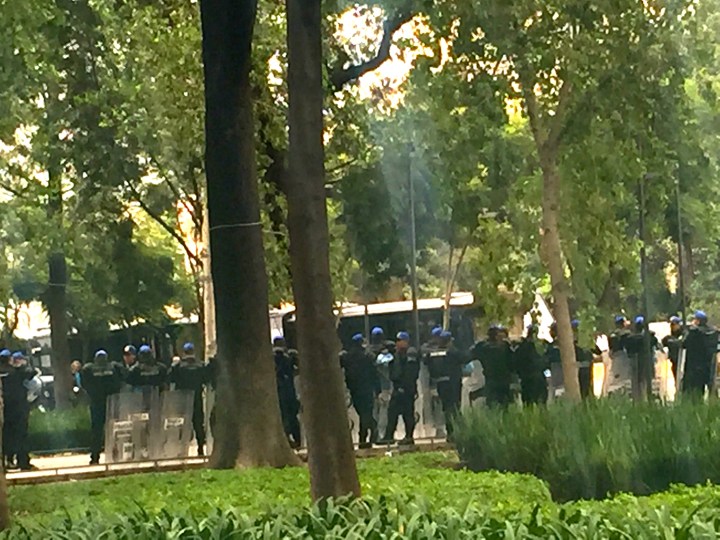 A few vans full of police decked out with riot shields on Tuesday. I am taking this photo from a safe distance.