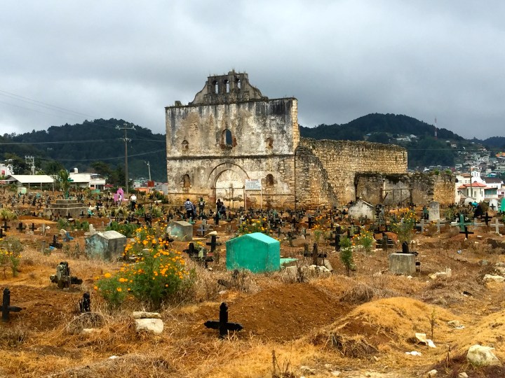 The ruins of the old church as you come into Chamula.  If you notice the different coloured crosses, black is for an old person, white for a baby and blue somewhere in between.  The people are sweeping the graves ready for Day of the Dead, when they will make offerings to their dead relatives.